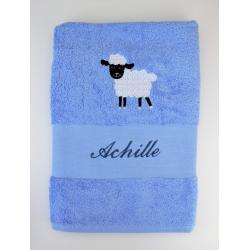 Serviette bleue brodée Achille et mouton